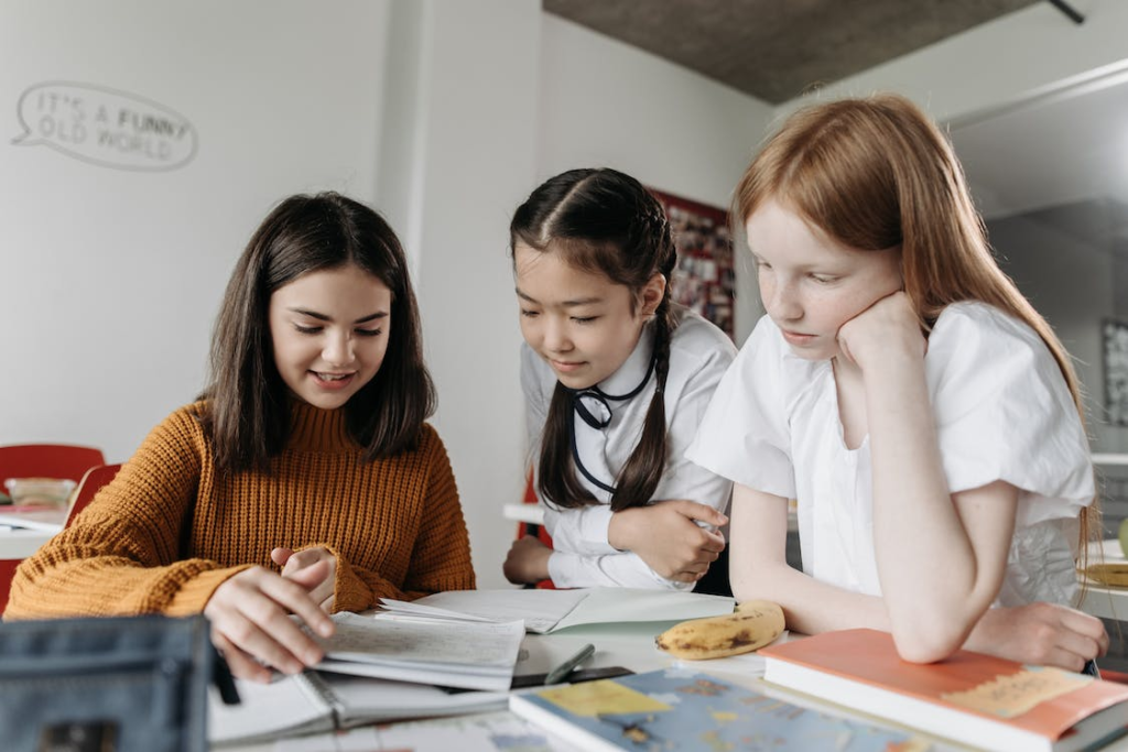 Three girls in a class.