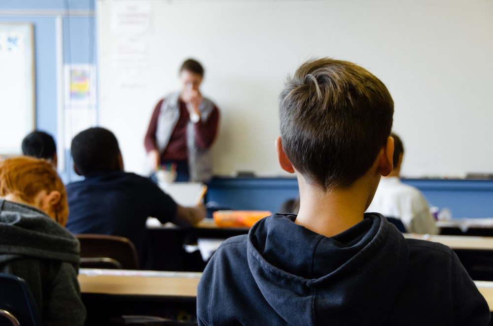 A class is in session with few students.
