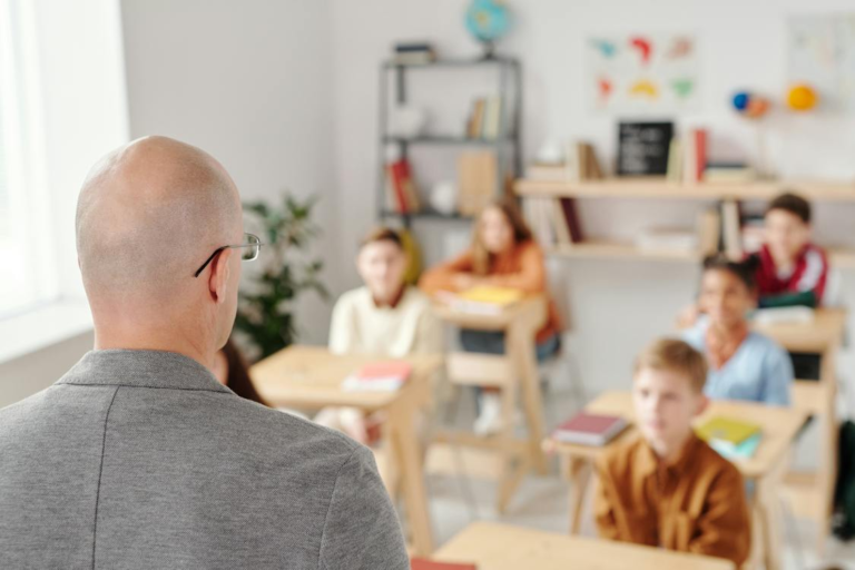 A teacher standing in front of the class.