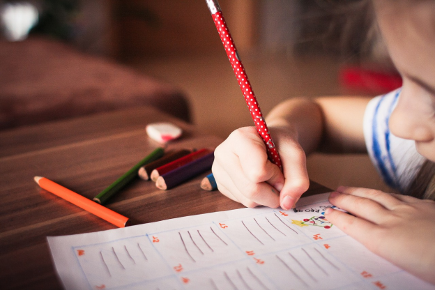 A kid with an activity sheet