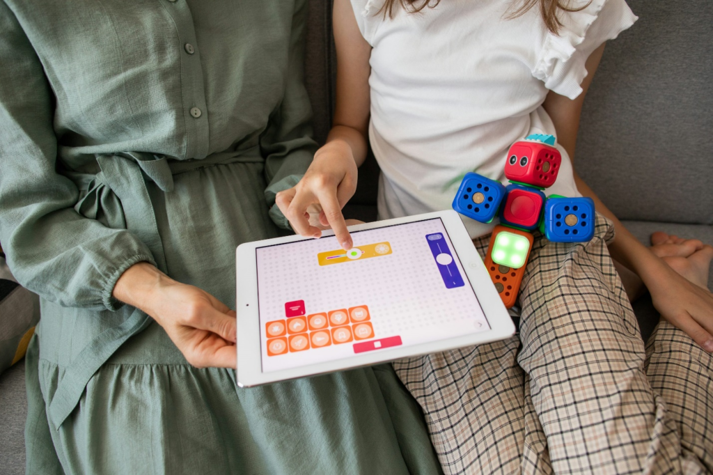 A child playing a game on her tablet