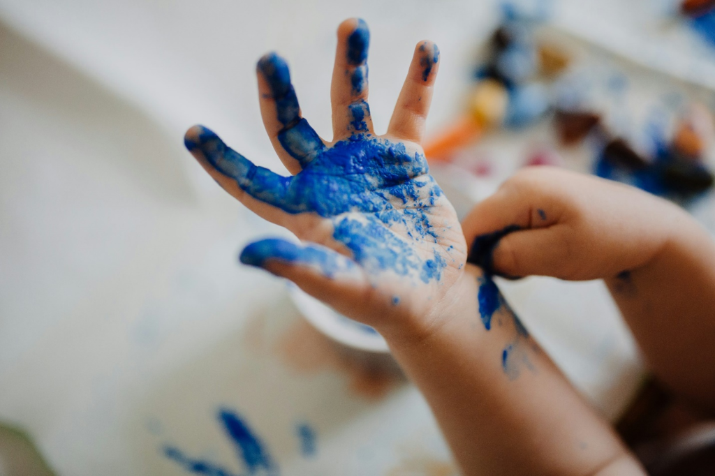  A kid with blue paint