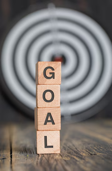 Dartboard and wooden cubes with goal setting