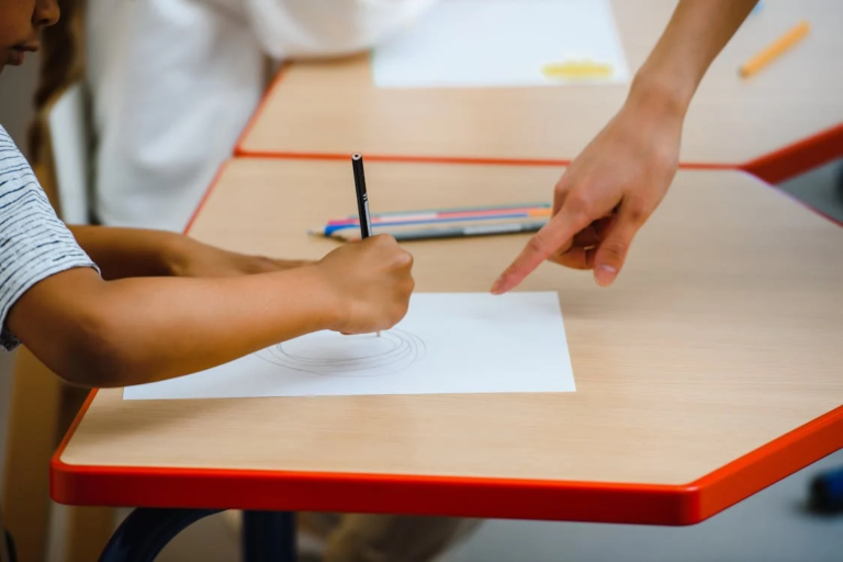 Child drawing on paper