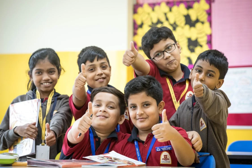 A group of students giving a thumbs up